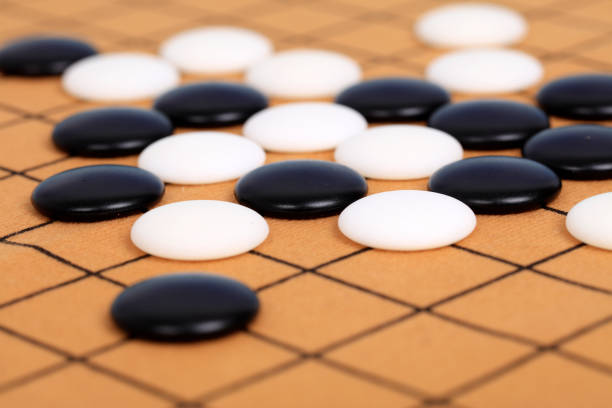 istock chinese game go,  Gobang and go game board 1302599168