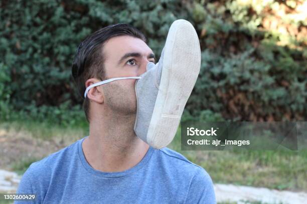 Comedian With Shoe Covering Mouth Stock Photo - Download Image Now - Meme, Coronavirus, Protective Face Mask