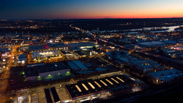 istock Large illuminated business park at dusk - aerial view 1302601457