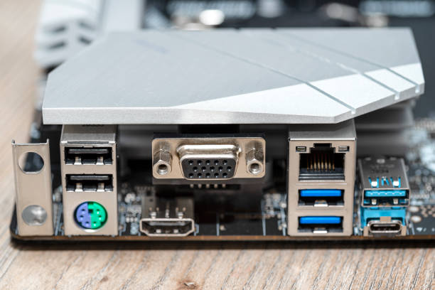 The rear panel of a desktop computer motherboard with visible connectors, USB, VGA, PS2 and RJ45 network card. The rear panel of a desktop computer motherboard with visible connectors, USB, VGA, PS2 and RJ45 network card. ps2 ports stock pictures, royalty-free photos & images