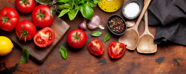 istock Italian cuisine ingredients. Tomatoes, herbs and spices 1302603343