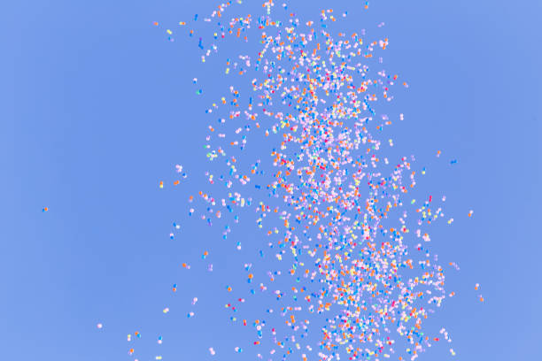 istock many colorful balloon flying in blue sky 1302603351