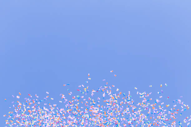istock many colorful balloon flying in blue sky 1302603371