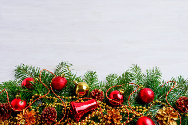 istock Christmas background with pine cone, golden and red decors 1302604095
