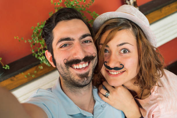 istock Young attractive couple making selfie 1302604690
