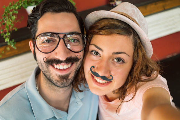 istock Young attractive couple making selfie 1302604692