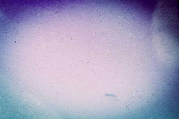 istock Abstract blue and purple scratched film background 1302606048