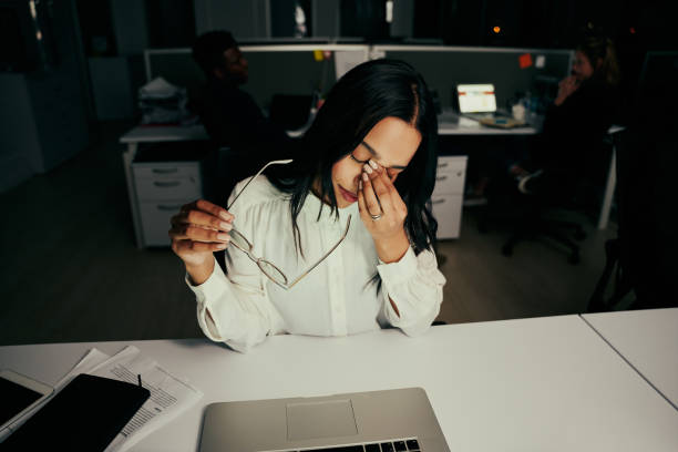 istock Stressed overworked young businesswoman taking off glasses tired from computer work feeling headache in office 1302607276