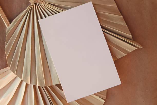 istock Empty paper and Dried palm leaves. Flat lay composition 1302612793