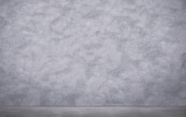 istock Front view of blank gray cement wall with concrete floor in loft style 1302614442