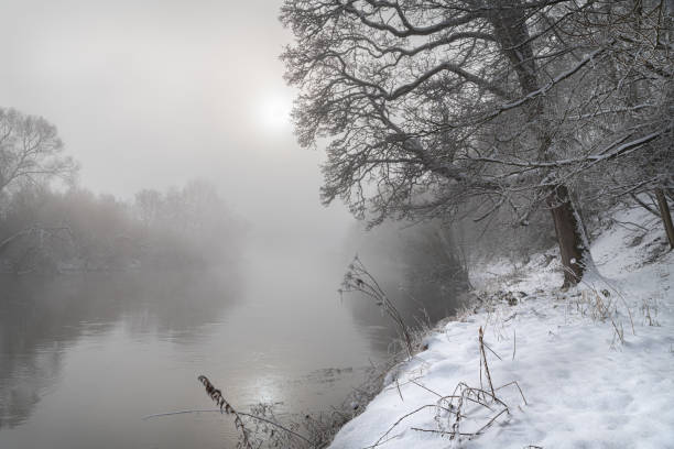 istock Sun breaking through the mist over the Teviot River in winter snow in the Scottish Borders 1302616416