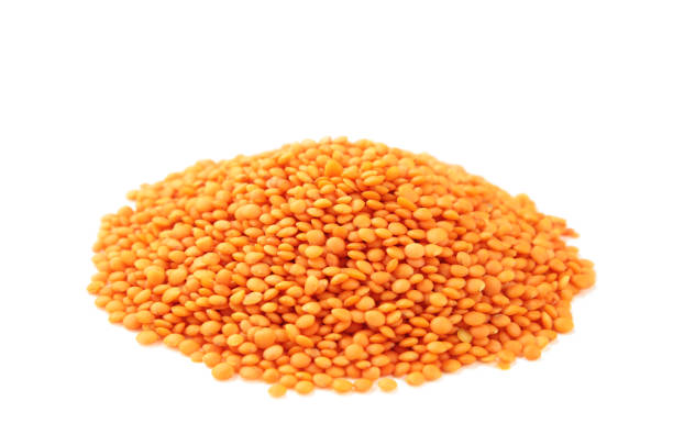 istock Red lentils isolated on a white background. 1302618492