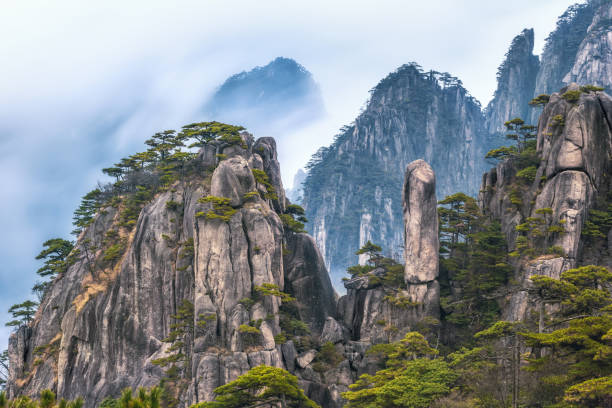 view from Refreshing terrace in Huangshan mountain, known as Yellow mountain, Anhui, China. view from Refreshing terrace in Huangshan mountain (Yellow mountain), known as the loveliest mountain of China, World Natural and Cultural Heritage site by UNESCO, Anhui, China. anhui province stock pictures, royalty-free photos & images