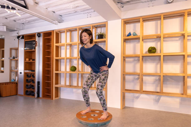 Sports athletes exercising in gym and doing yoga on the rooftop of the building and indoor gym.