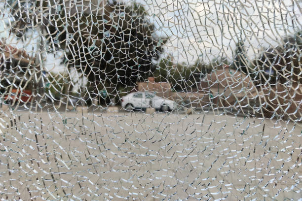 istock broken glass. view through cracks in broken glass 1302621774