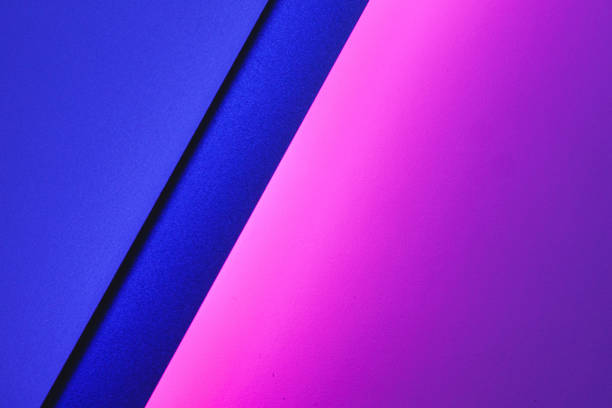 istock Blank paper sheets rolled in a neon purple lighting 1302622207