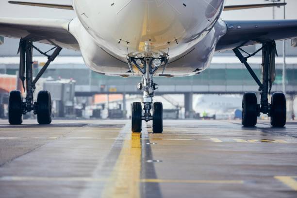 istock Airplane taxiing to runway before take off 1302623349