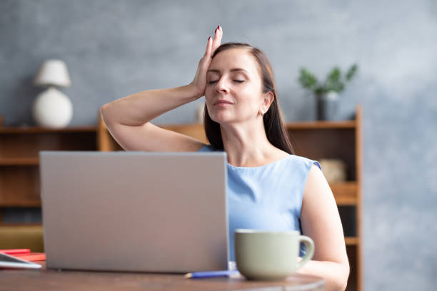 istock Woman training neck muscles resting taking a break from work. 1302624225