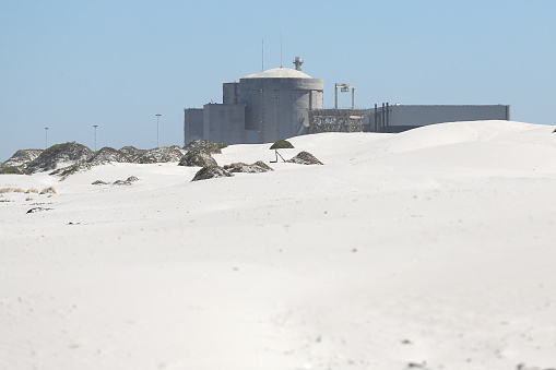 Cape Town, South Africa - 16 February 2021: A general view of the Koeberg Nuclear Power Station near Melkbos on February 16, 2021 in Cape Town, South Africa. It is reported that both Eskom and the National Nuclear Regulator (NNR) have dismissed safety claims raised by activists that sea air corrosion at the Koeberg containment building endangers the public.
