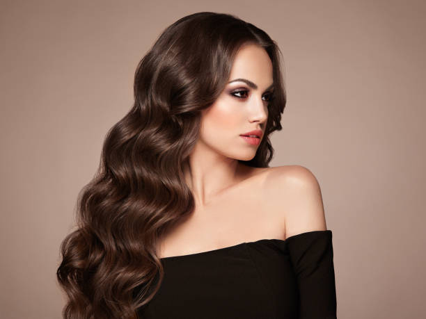 istock Brunette woman with curly hair 1302625337