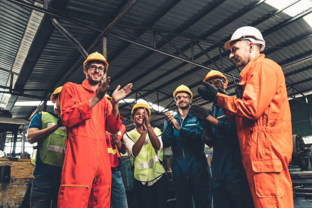istock Skillful worker celebrate success in the factory . 1302625643