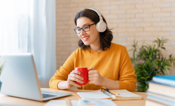 istock woman working on laptop at home. 1302627174