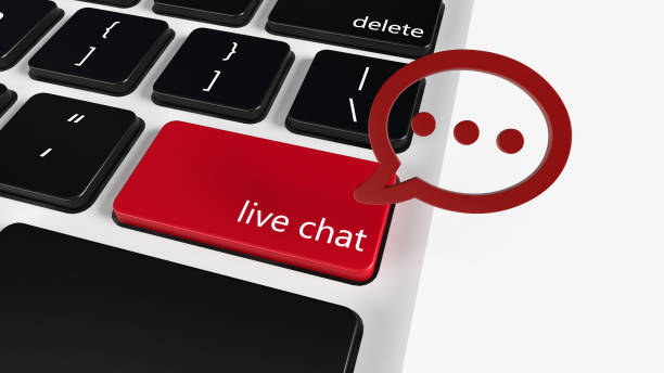 istock Live chat online conversation, digital web messaging, social network concept : Close-up of a computer keyboard with words live chat and a message balloon, depict customer service via instant message. 1302629007