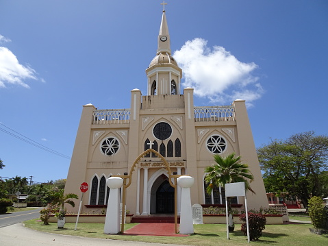 Saint Joseph Church is located in Inarajan, Guam. It was established by the Spanish in the late 1680. Two latte stones in white denote local Chamorro culture as latte stones used to be pillars in traditional house building.