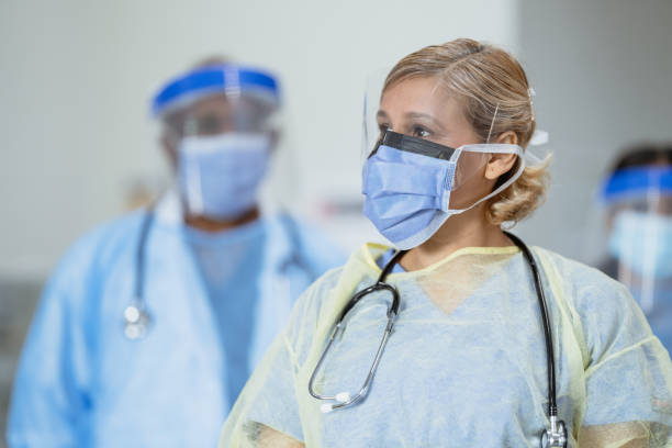 istock Female doctor dressed in personal protective equipment (PPE) 1302631507