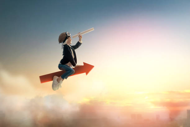 istock businessman child on sunset background 1302631933