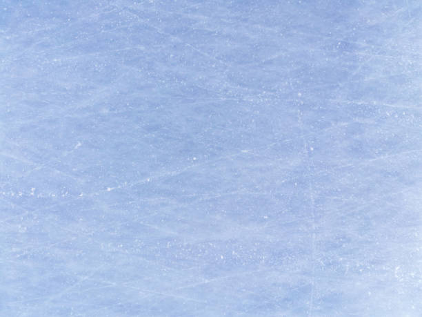 istock Blue Ice Rink With Snow Texture in skate scratches on an open pond. horizontal background 1302632611