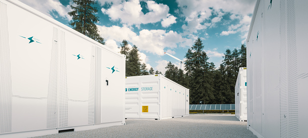Moderno sistema de almacenamiento de energía verde de batería de contenedor acompañado de paneles solares y turbina eólica situado en la naturaleza renderizado 3D. photo