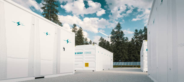 modern container battery green energy storage system accompanied with solar panels and wind turbine situated in nature 3d rendering. - storage containers imagens e fotografias de stock