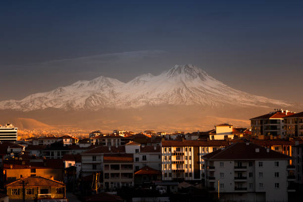 istock city ​​and mountain. mountain view in distorted urbanization background 1302633276