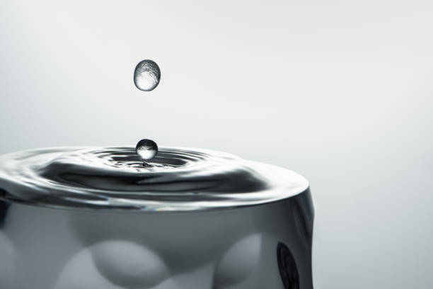 Splash: drops falling into a glass full of water - still life