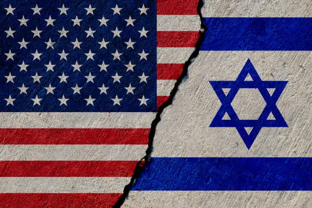 usa and israel flags painted on concrete wall
