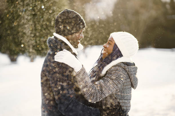 istock African american couple in a winter forest 1302637332