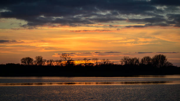istock Sunset on the lake. Beautiful landscape at sunset. 1302638867