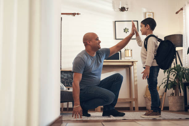 istock Raise them good, praise them good 1302638930