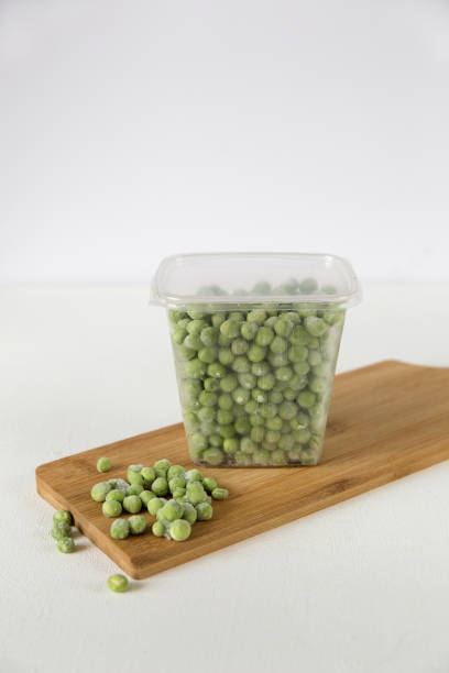 istock Frozen vegetables in transparent containers on a white plate. 1302644001