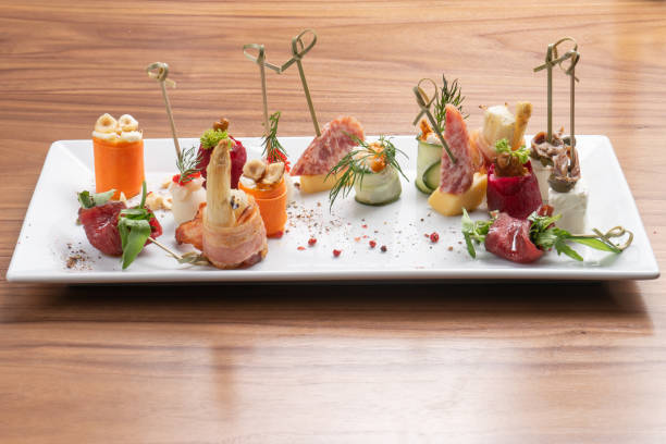 istock Assorted meat appetizers canapes on skewers to wine 1302645634