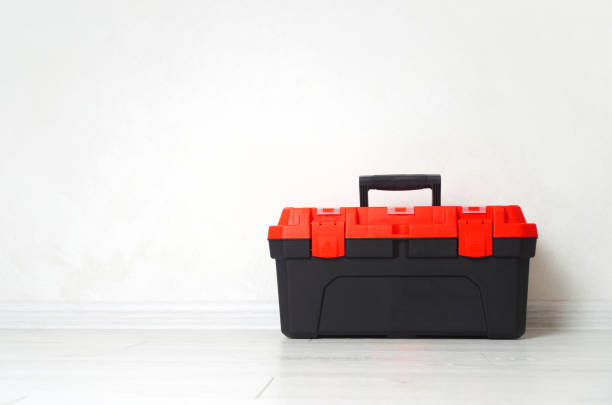 istock The toolbox or toolkit box is on the wooden floor. Background with copy space. 1302645754