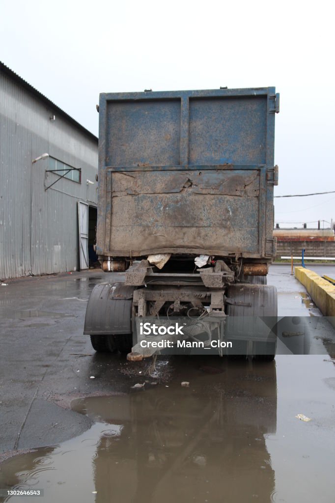 Waste container on a transport trailer Industrial Garbage Bin Stock Photo
