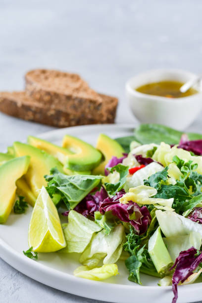 istock Keto food salad avocado, egg, green kale and spinach 1302647409