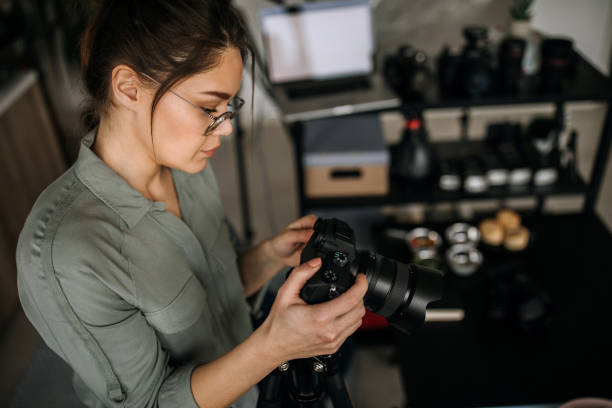 istock Young photographer in her home studio office 1302647740