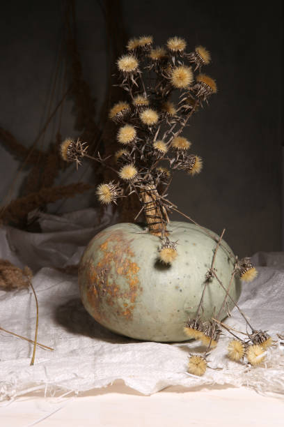 istock Still life with pumpkin and dried flowers. 1302647792