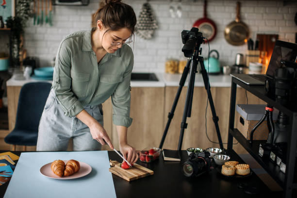 istock Young female food photographer setting everything up for shooting 1302647799