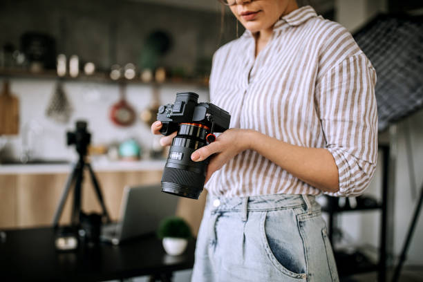 istock Female photographer working in a studio 1302647826