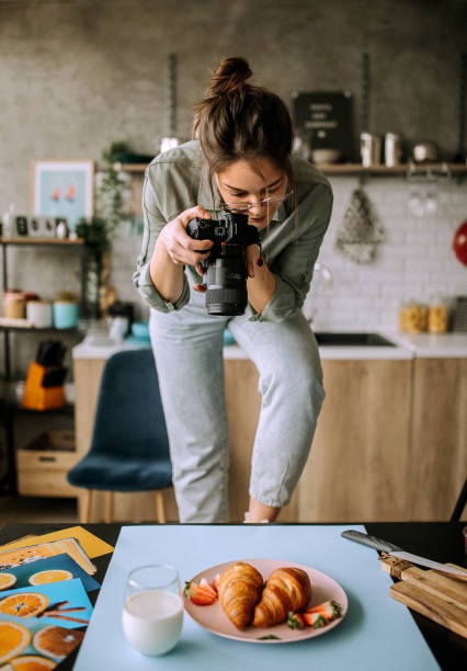 istock Young female food photographer in work 1302647844