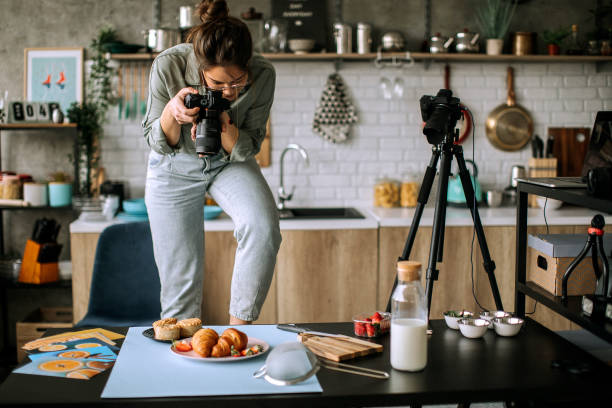 istock Young female food photographer in work 1302647867